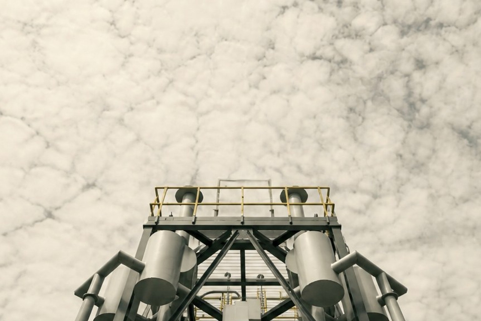 Small modular reactor upper assembly against an overcast sky